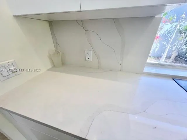 a stove top oven sitting inside of a kitchen