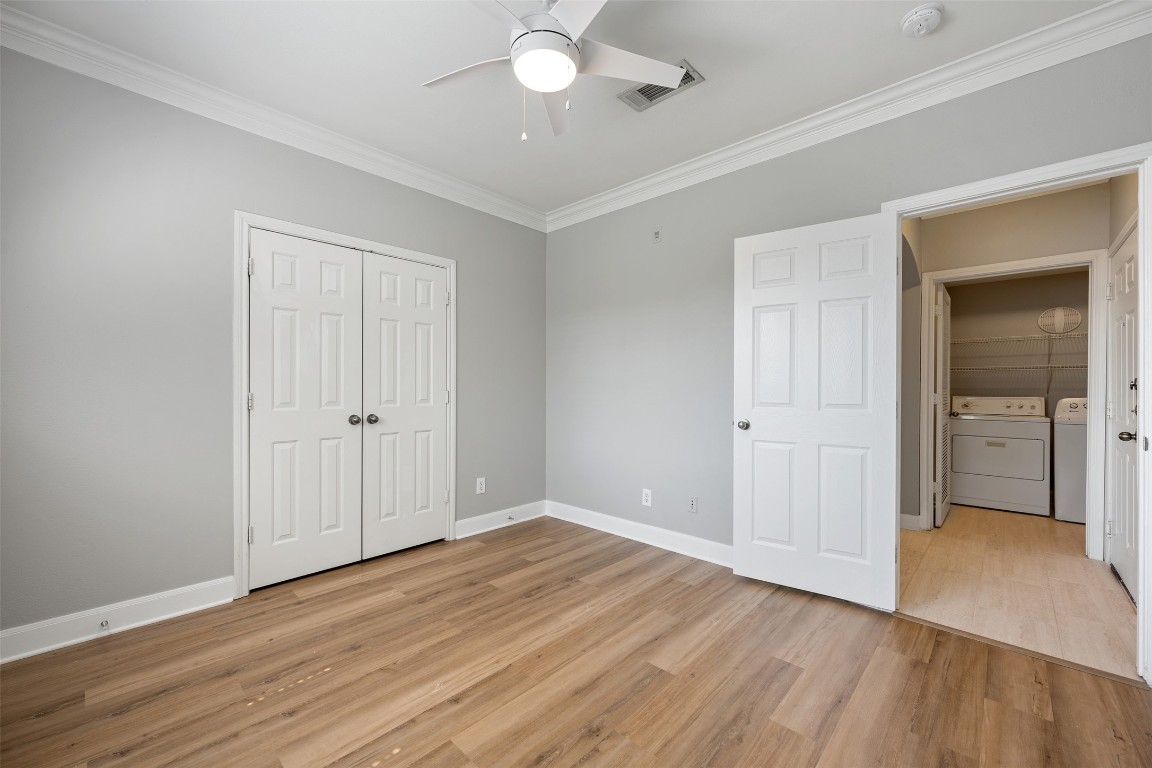7701 Rialto Boulevard, Unit 1433 Austin, TX 78735 - Photo 12 of 31 a view of an empty room and wooden floor