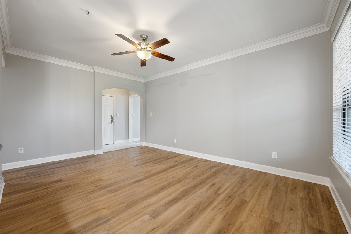 7701 Rialto Boulevard, Unit 1433 Austin, TX 78735 - Photo 16 of 31 a view of an empty room with wooden floor and a window