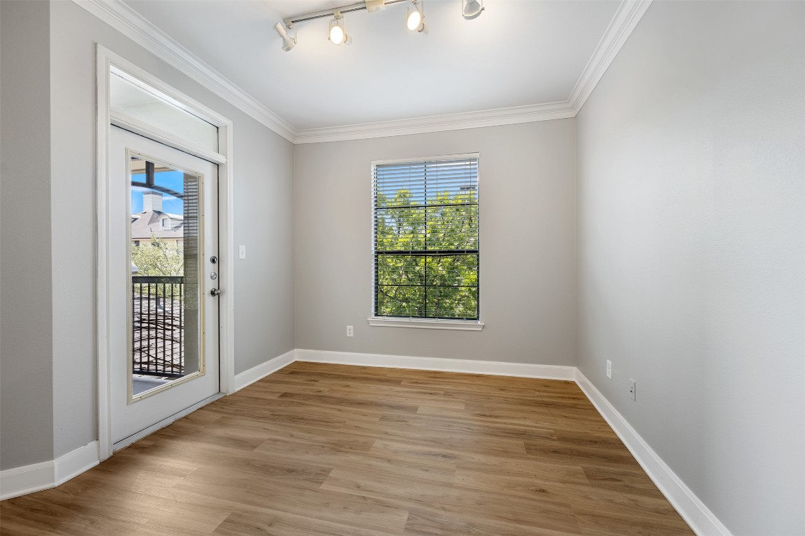 7701 Rialto Boulevard, Unit 1433 Austin, TX 78735 - Photo 17 of 31 wooden floor in an empty room with a window