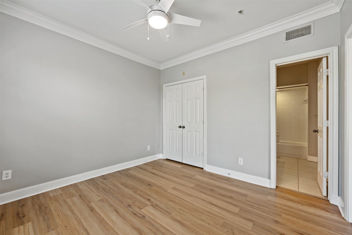 7701 Rialto Boulevard, Unit 1433 Austin, TX 78735 - Photo 23 of 31 a view of an empty room with wooden floor