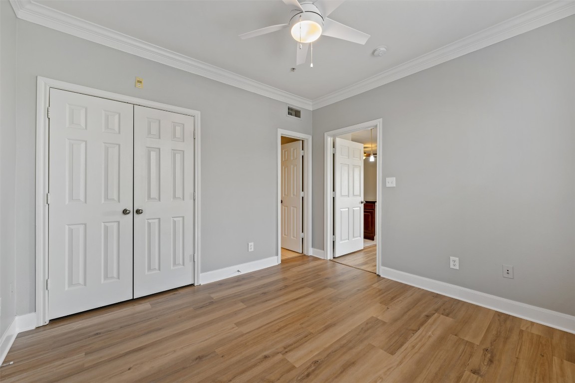 7701 Rialto Boulevard, Unit 1433 Austin, TX 78735 - Photo 24 of 31 a view of an empty room with wooden floor
