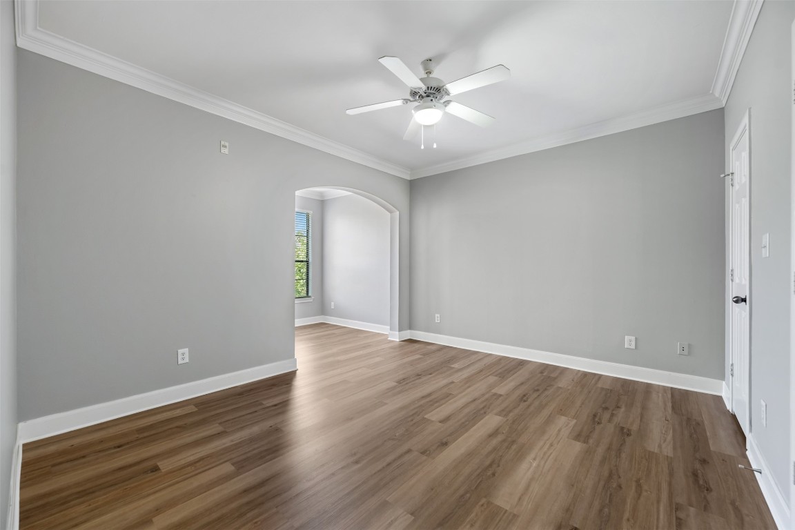 7701 Rialto Boulevard, Unit 1433 Austin, TX 78735 - Photo 26 of 31 a view of an empty room with wooden floor