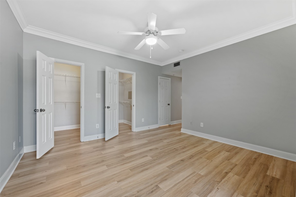 7701 Rialto Boulevard, Unit 1433 Austin, TX 78735 - Photo 29 of 31 a view of an empty room with wooden floor