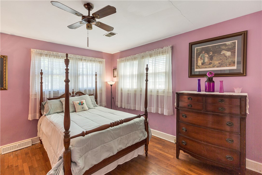 219 Beaty Square Anderson, SC 29624 - Photo 16 of 32 This spacious bedroom offers comfortable living with warm flooring and ample natural light.