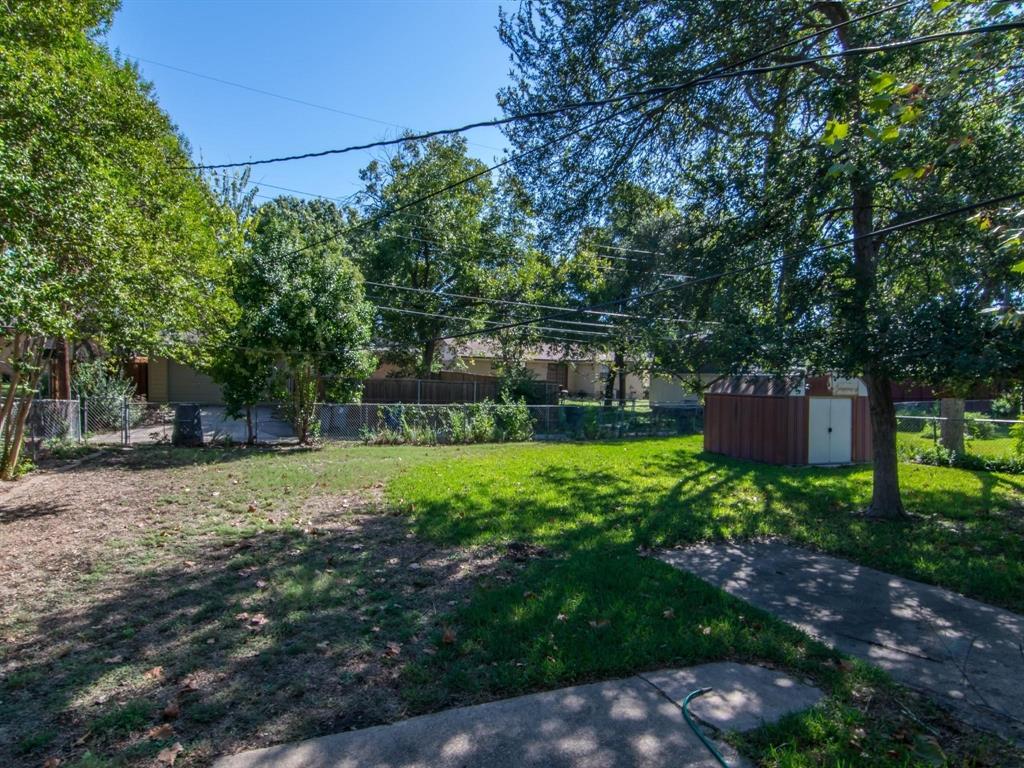 9302 Piper Lane Dallas, TX 75228 - Photo 11 of 13 a backyard of a house with lots of green space