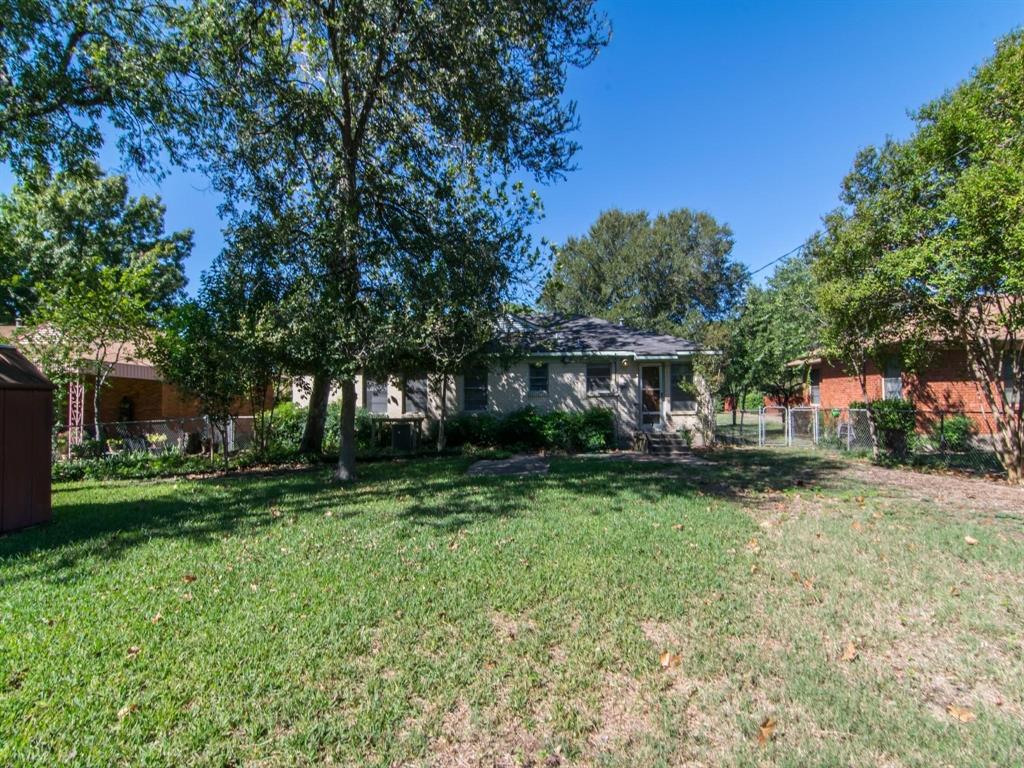 9302 Piper Lane Dallas, TX 75228 - Photo 12 of 13 a front view of a house with a yard