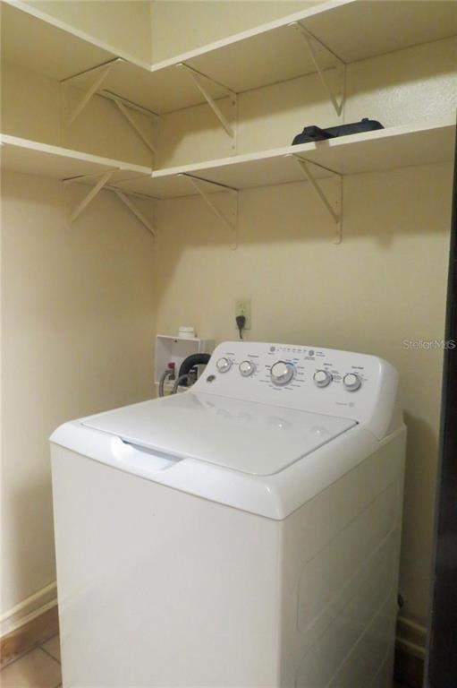 454 Cottage Circle, Unit 454 River Ranch, FL 33867 - Photo 22 of 27 a utility room with dryer and washer