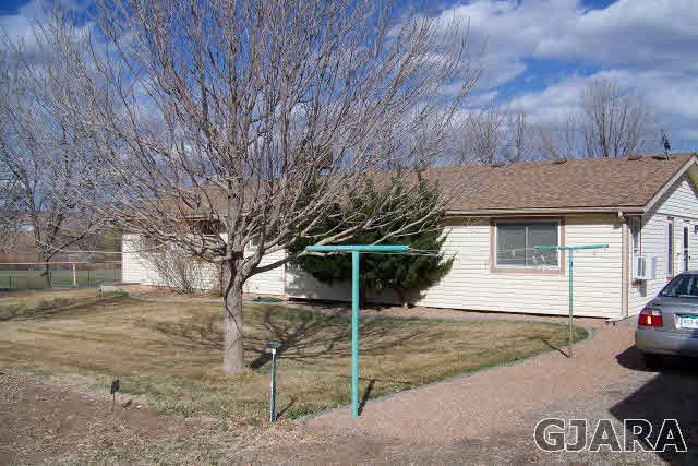3417 D Road Palisade, CO 81526 - Photo 3 of 16 a view of a house with a yard
