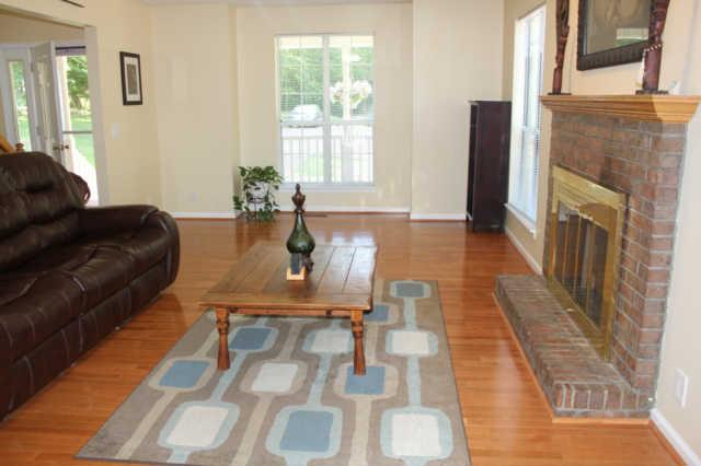 1500 CC Road Kingston Springs, TN 37082 - Photo 5 of 19 Have a seat and relax by your cozy wood burning fireplace. Could easily be converted to gas. Windows make you feel like you are in a sunroom. Views everywhere!