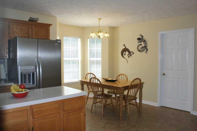 1500 CC Road Kingston Springs, TN 37082 - Photo 7 of 19 Oversized kitchen with a large breakfast nook. Bay window makes it all the better. Kitchen island makes it nice to cook and visit at the same time.