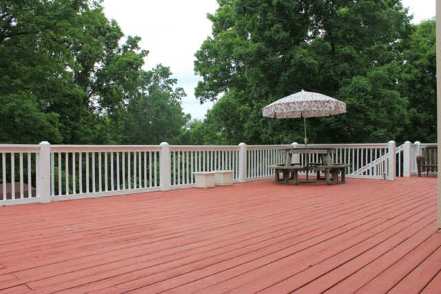 1500 CC Road Kingston Springs, TN 37082 - Photo 10 of 19 Large deck for all your summer to fall fun! Grill and have room enough to eat outdoors. Kids can have room to play afterwards. Puppies too! If you look you can see where you have quite a view to enjoy!
