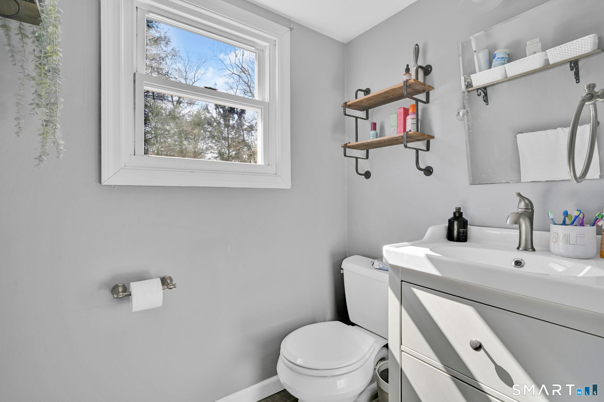 256 Albrecht Road Torrington, CT 06790 - Photo 21 of 31 a bathroom with a toilet a sink and mirror