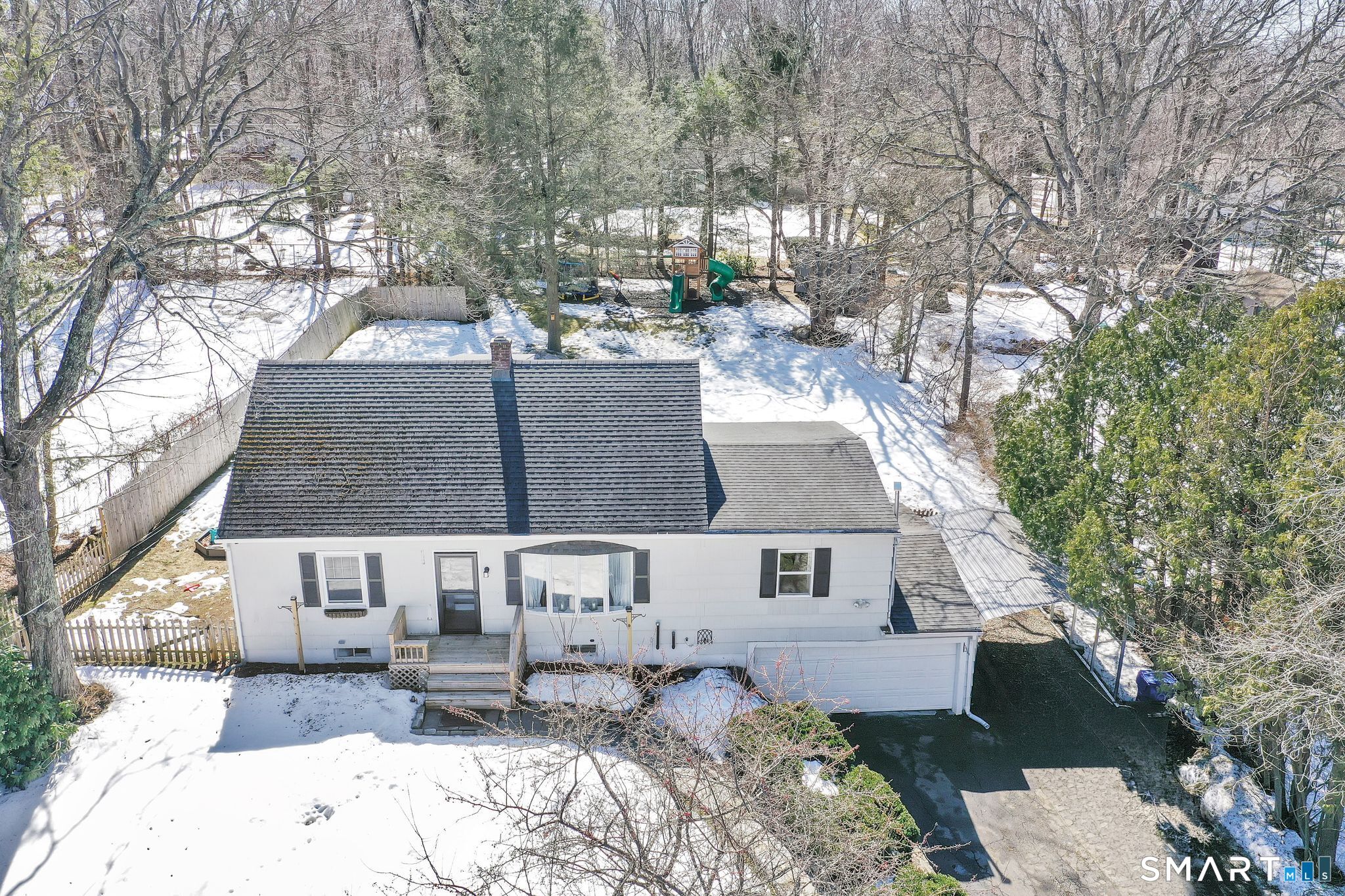 256 Albrecht Road Torrington, CT 06790 - Photo 26 of 31 a front view of a house with a yard covered in snow