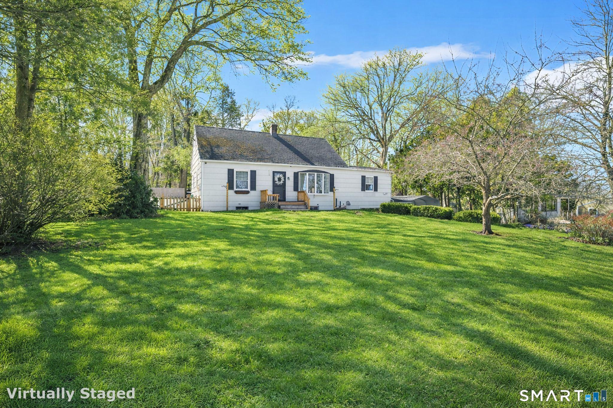 256 Albrecht Road Torrington, CT 06790 - Photo 27 of 31 a view of a house with a big yard and large trees