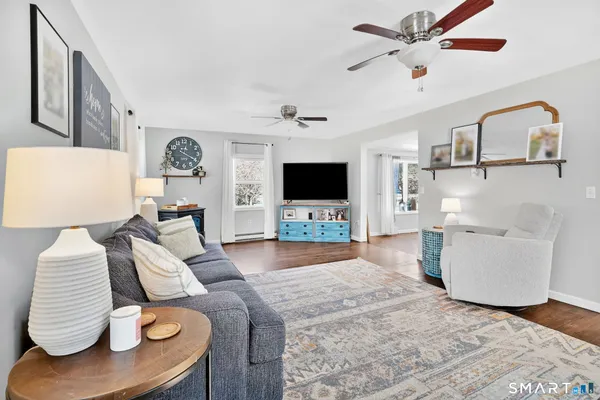 a kitchen with stainless steel appliances a stove microwave and sink
