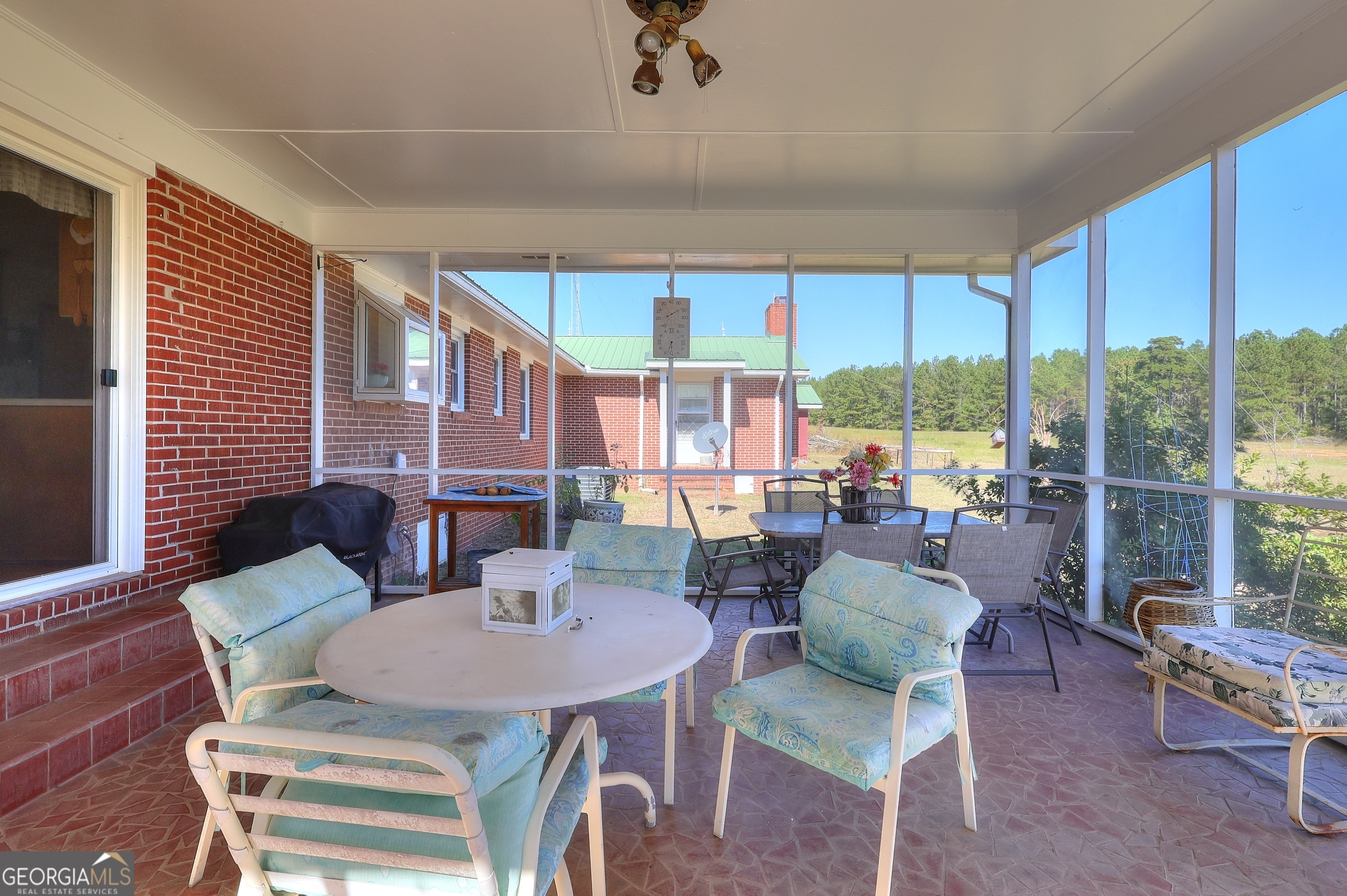2850 Liberty Church Road White Plains, GA 30678 - Photo 23 of 33 a living room with furniture and a floor to ceiling window