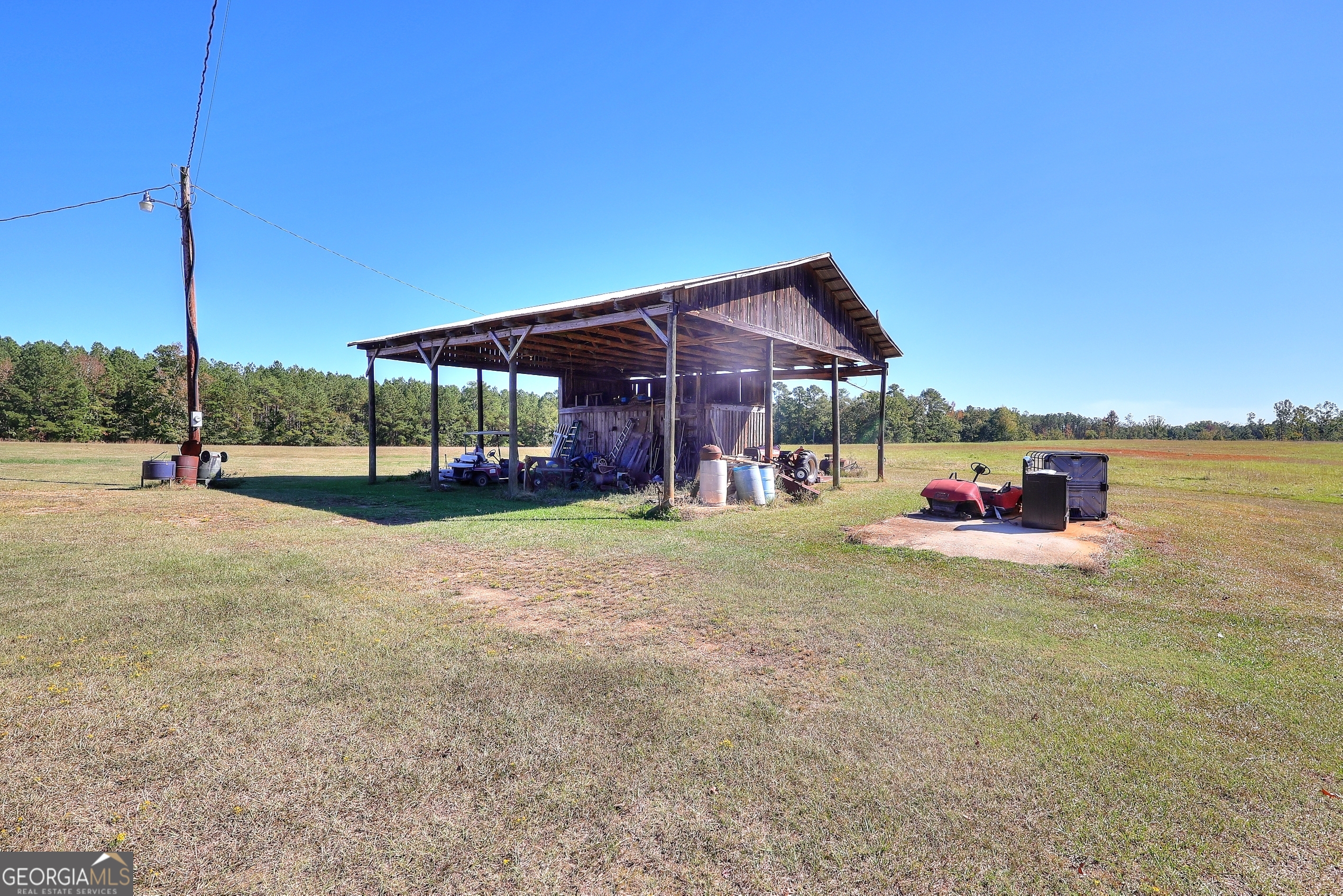 2850 Liberty Church Road White Plains, GA 30678 - Photo 26 of 33 a view of a house with a yard and sitting area