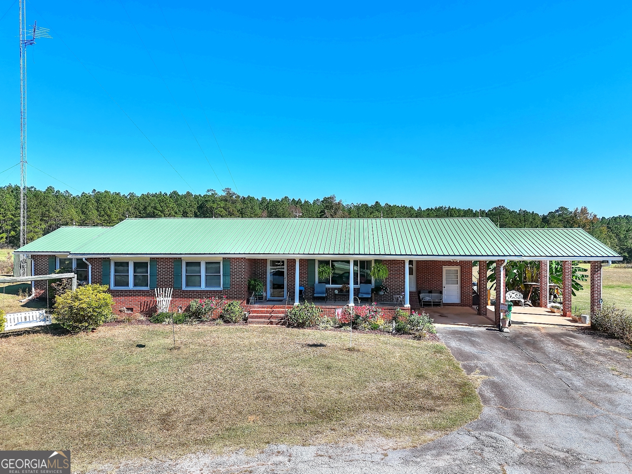 2850 Liberty Church Road White Plains, GA 30678 - Photo 3 of 33 a view of large building with a swimming pool and patio