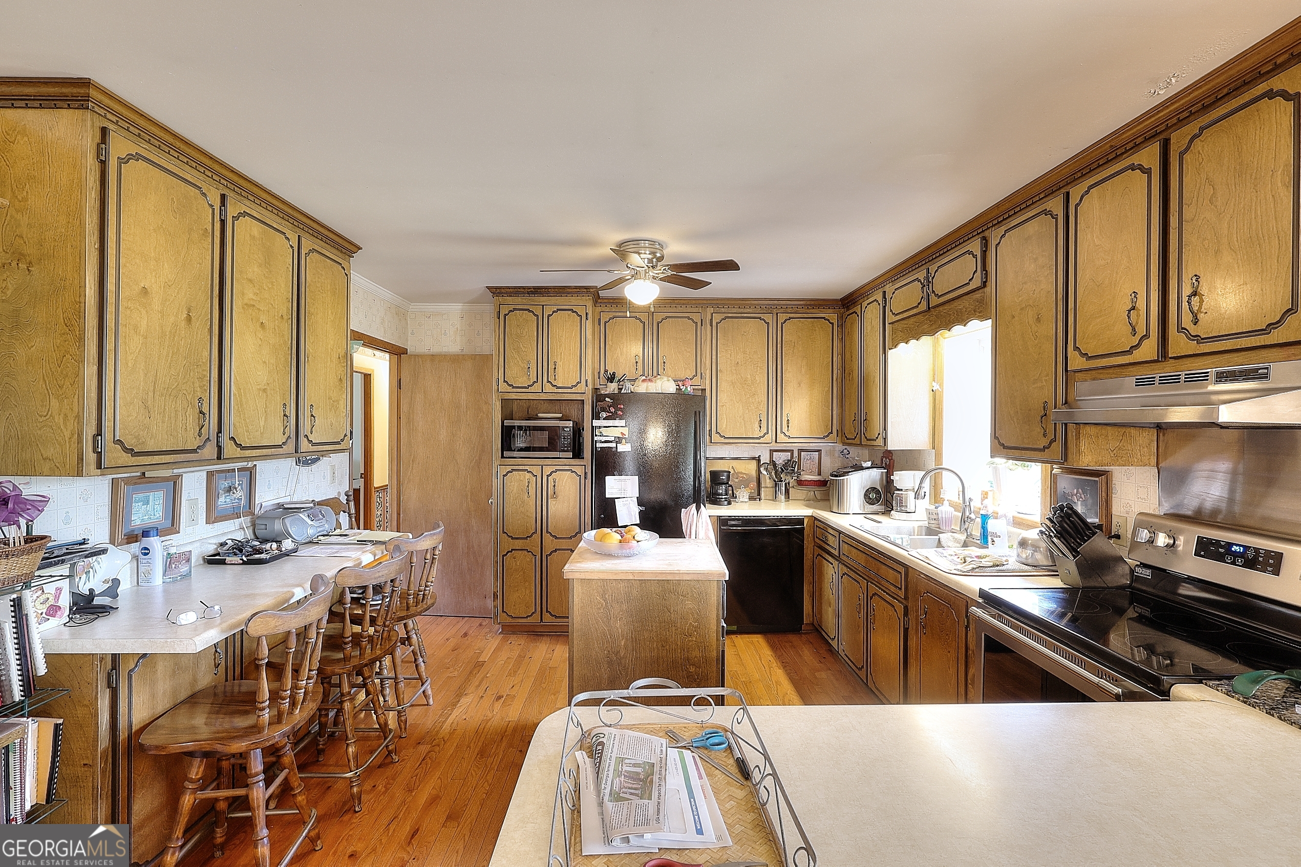 2850 Liberty Church Road White Plains, GA 30678 - Photo 7 of 33 a kitchen with stainless steel appliances kitchen island granite countertop a sink and cabinets