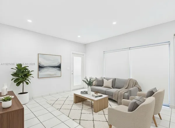 a kitchen with stainless steel appliances granite countertop a refrigerator a stove and a sink with wooden floor