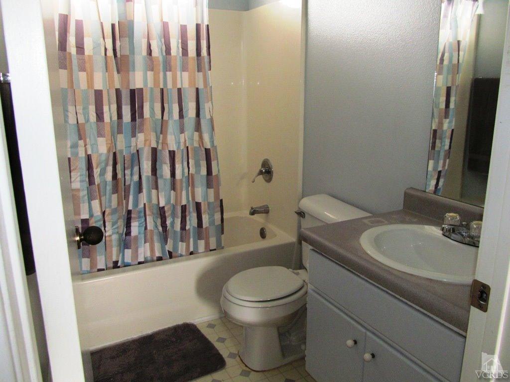 4508 Apricot Road, Unit A Simi Valley, CA 93063 - Photo 15 of 27 a bathroom with a toilet a sink and a mirror