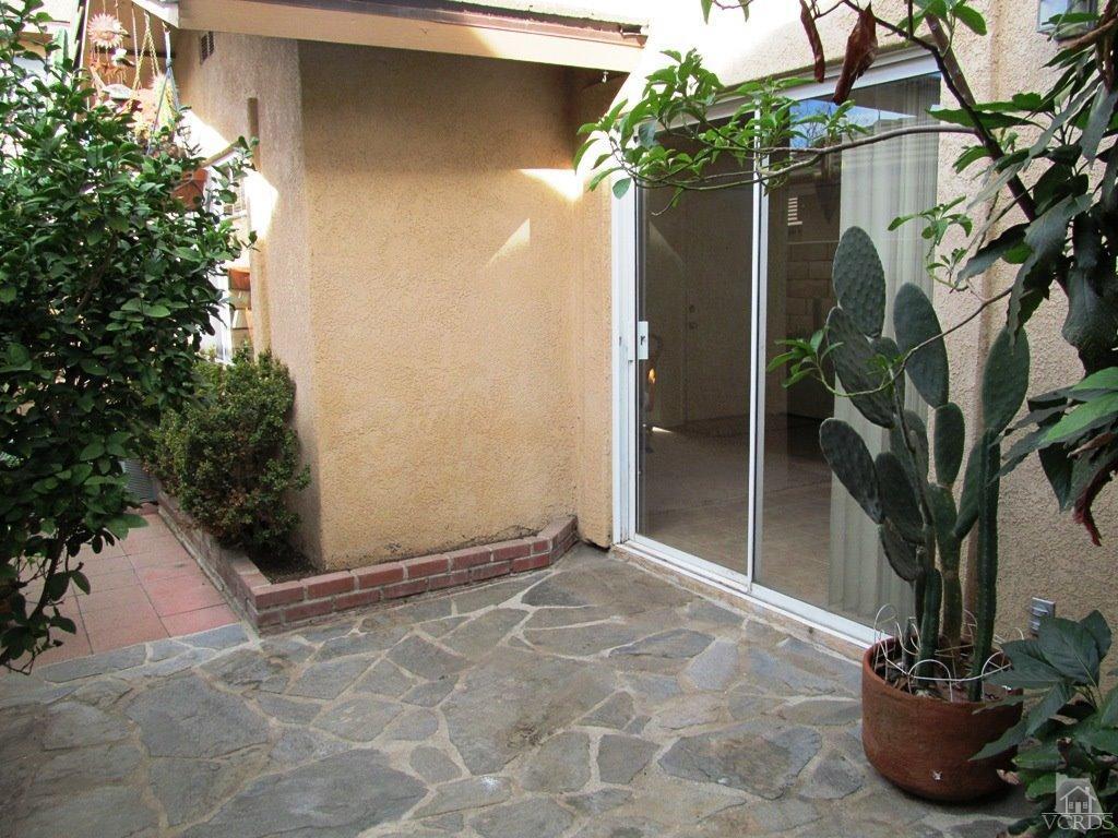 4508 Apricot Road, Unit A Simi Valley, CA 93063 - Photo 19 of 27 a view of a potted plants in front of a door
