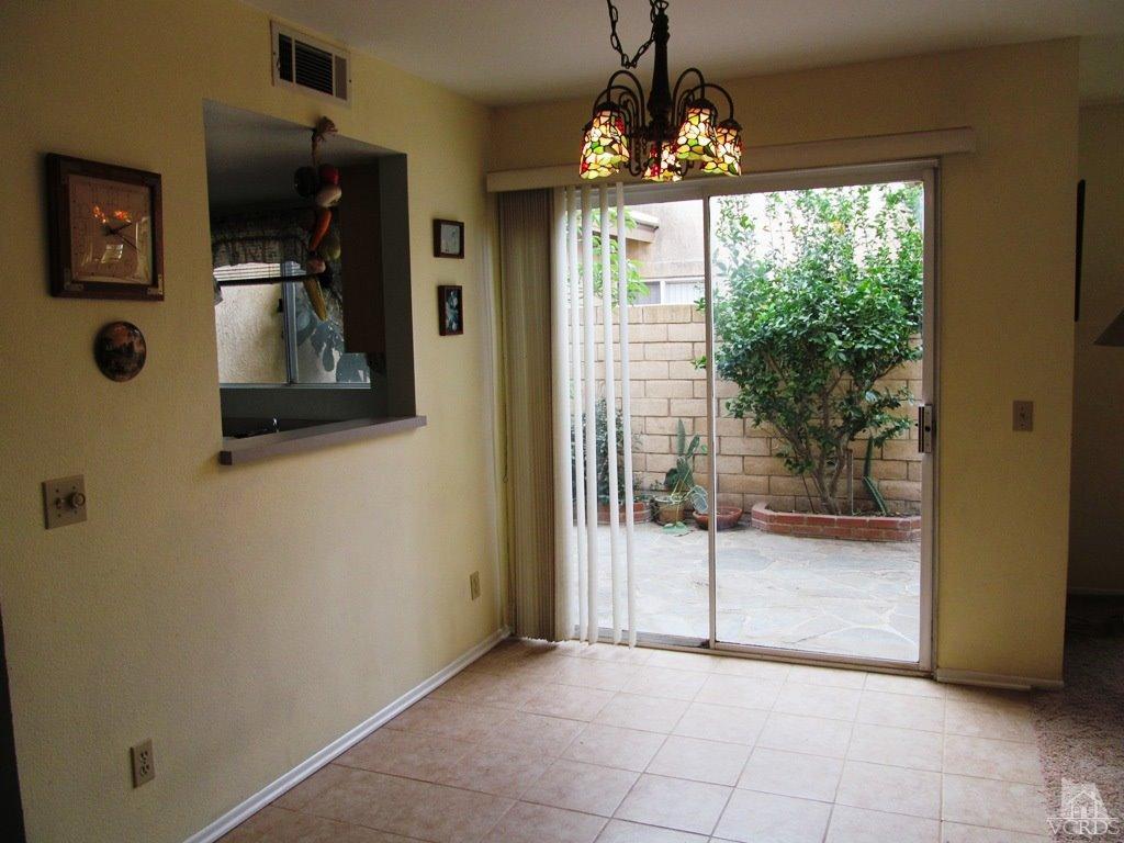 4508 Apricot Road, Unit A Simi Valley, CA 93063 - Photo 6 of 27 a view of a hallway with a chandelier and livingroom