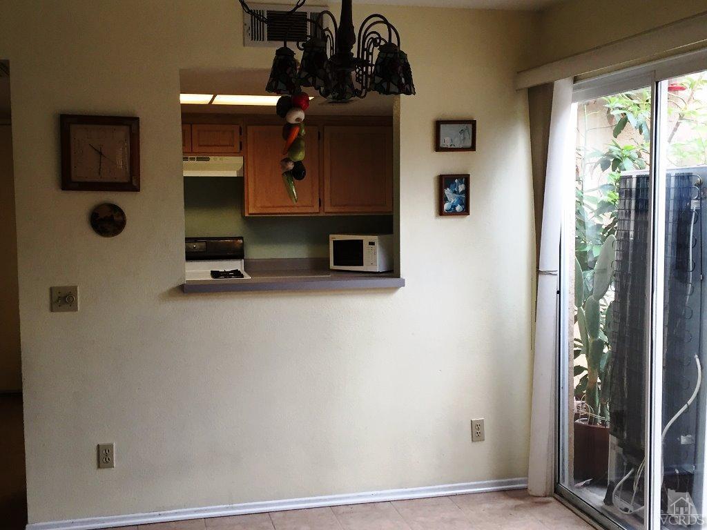 4508 Apricot Road, Unit A Simi Valley, CA 93063 - Photo 7 of 27 a room with wooden floor and a flat screen tv