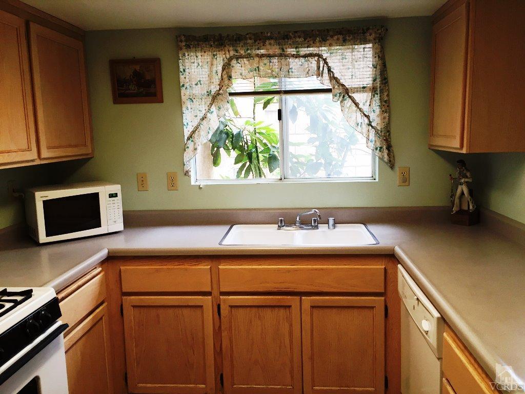 4508 Apricot Road, Unit A Simi Valley, CA 93063 - Photo 8 of 27 a view of a kitchen with a sink and a window