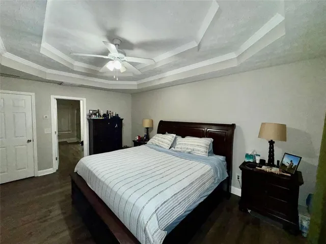 a kitchen with a sink a window and cabinets