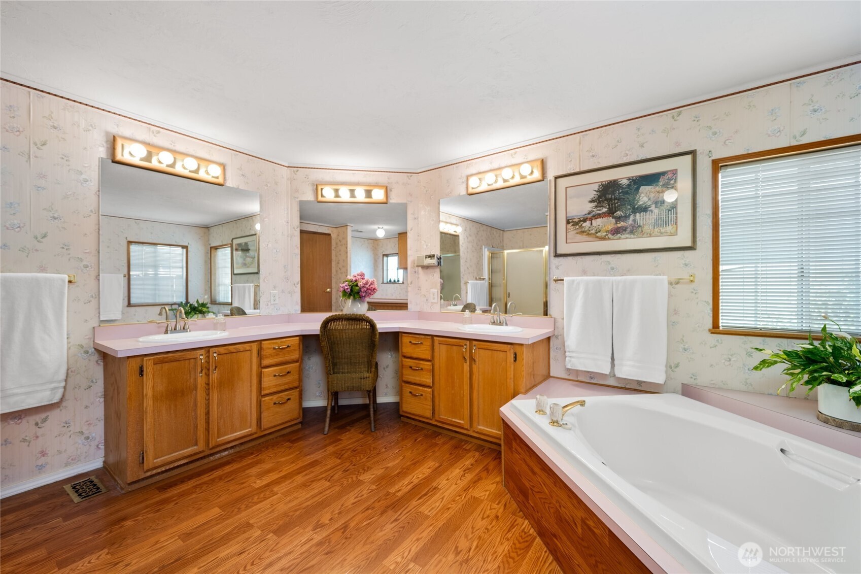 2015 24th Street, Unit 101 Bellingham, WA 98225 - Photo 19 of 24 a large bathroom with a tub a sink and mirror