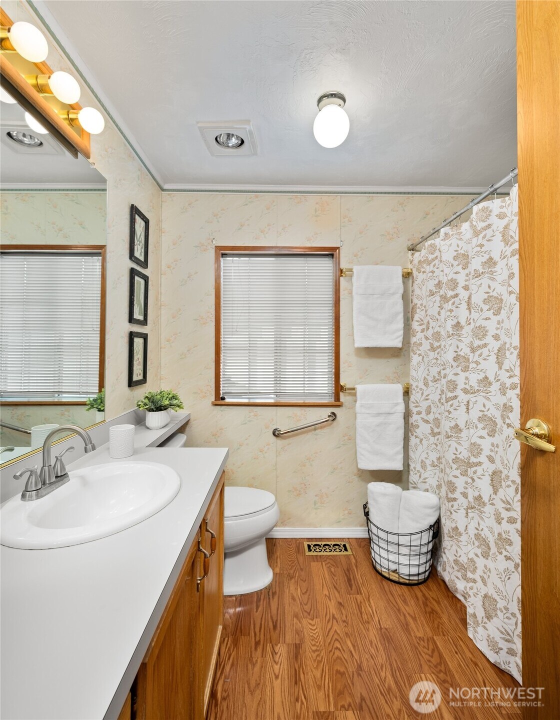 2015 24th Street, Unit 101 Bellingham, WA 98225 - Photo 21 of 24 a bathroom with a sink toilet a mirror and bathtub