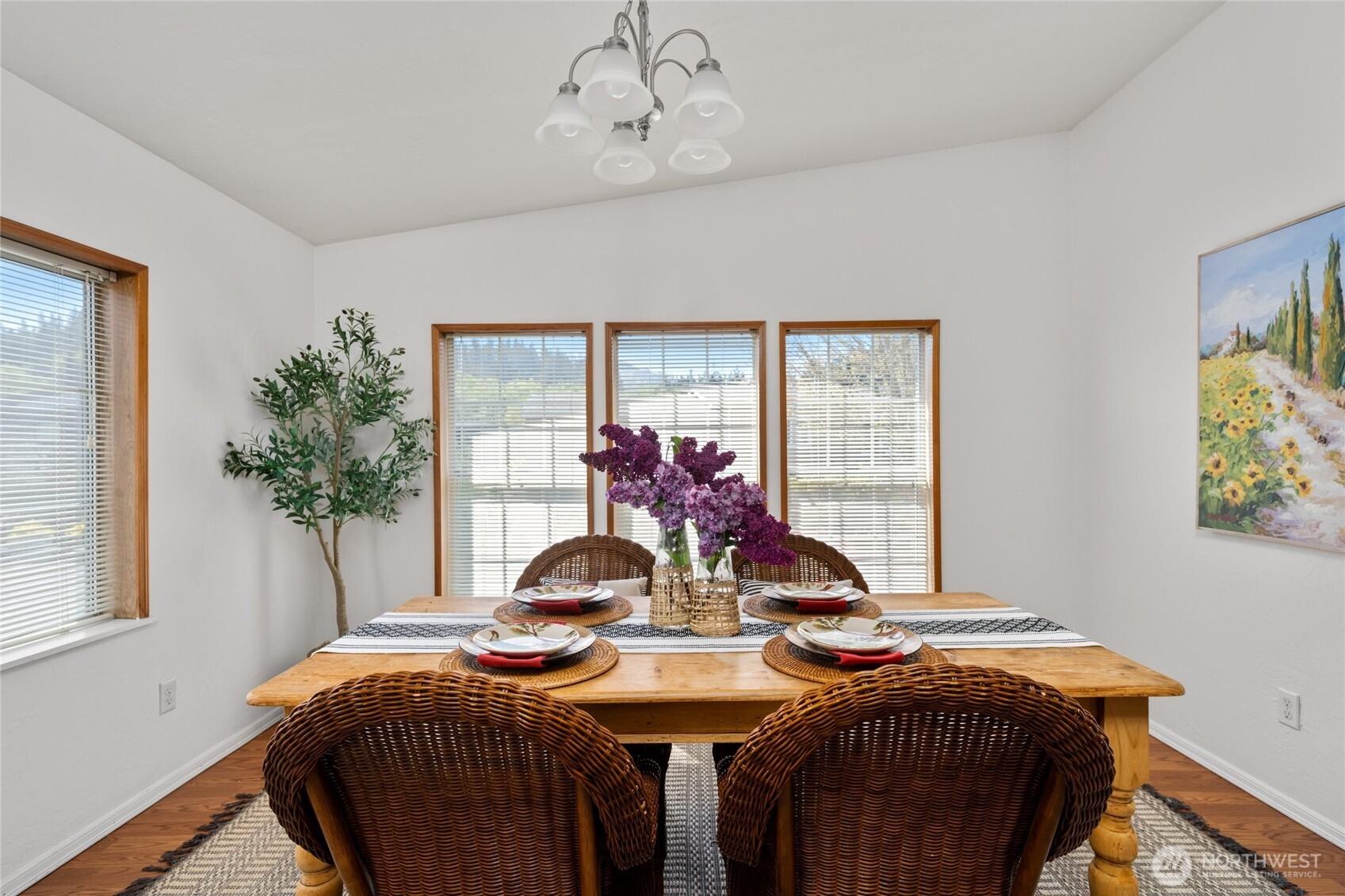 2015 24th Street, Unit 101 Bellingham, WA 98225 - Photo 10 of 24 a view of a dining room with furniture and a chandelier