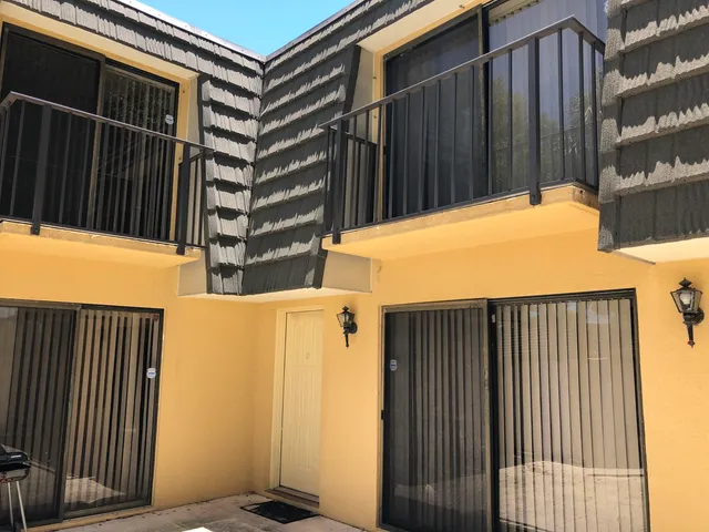 a view of a balcony with door