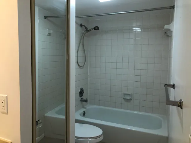 a bathroom with a bathtub and a shower