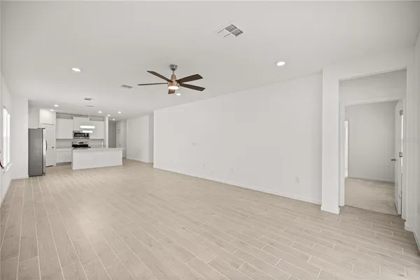 a room that has a bed and a large window