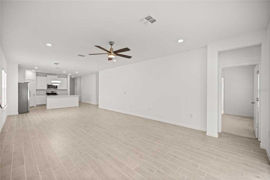 1604 Northwest 44th Court Road Ocala, FL 34482 - Photo 19 of 41 a view of a kitchen with a sink and a refrigerator