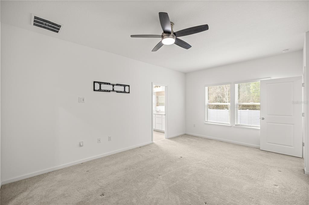 1604 Northwest 44th Court Road Ocala, FL 34482 - Photo 24 of 41 wooden floor in an empty room with a window