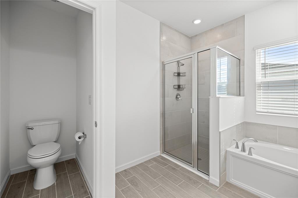 1604 Northwest 44th Court Road Ocala, FL 34482 - Photo 27 of 41 a bathroom with a toilet sink and shower