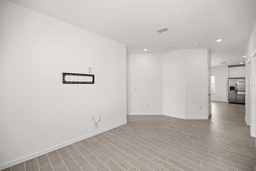 1604 Northwest 44th Court Road Ocala, FL 34482 - Photo 30 of 41 a view of a kitchen with a refrigerator and a stove top oven