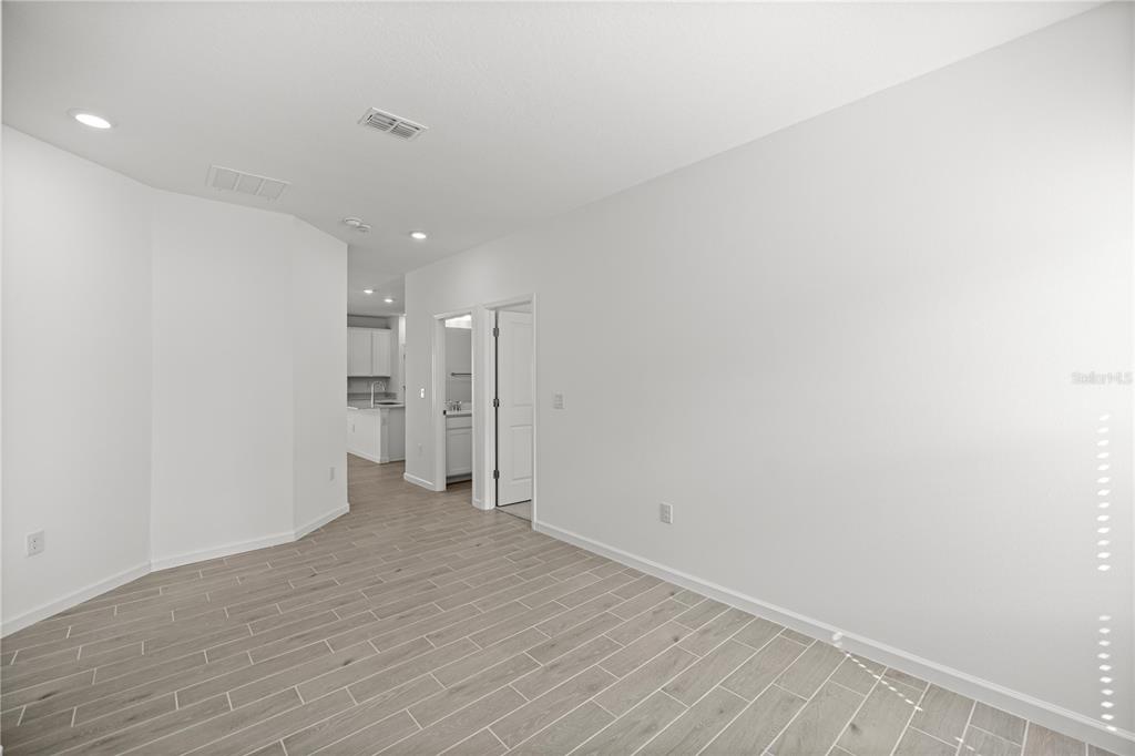 1604 Northwest 44th Court Road Ocala, FL 34482 - Photo 31 of 41 a view of a big room with wooden floor and windows