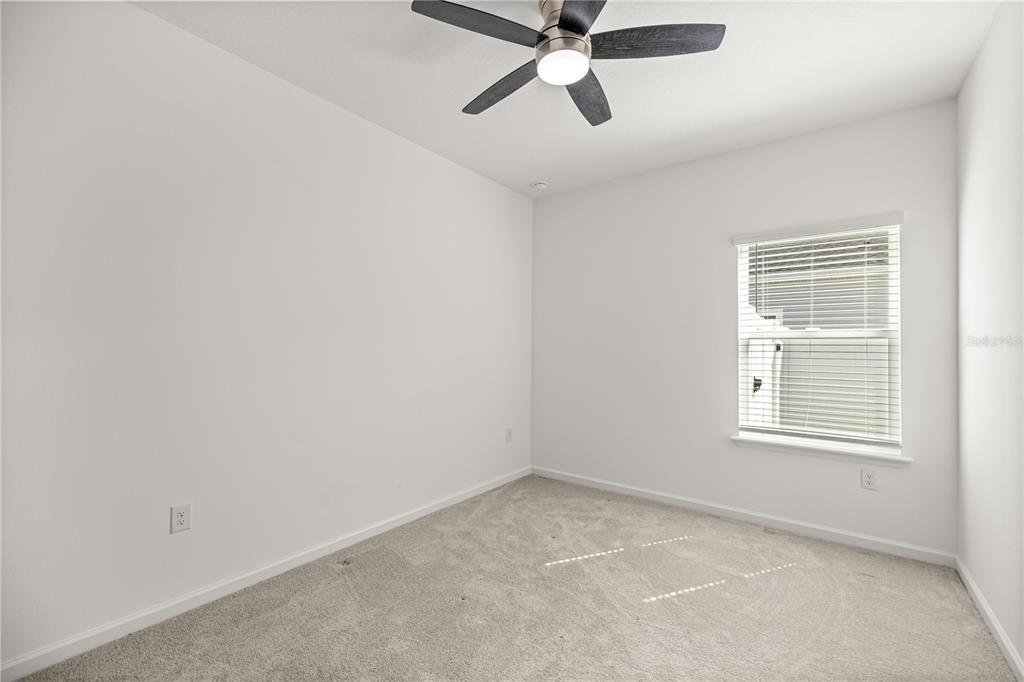 1604 Northwest 44th Court Road Ocala, FL 34482 - Photo 34 of 41 an empty room with a window and a fan