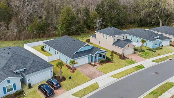 an aerial view of houses with yard