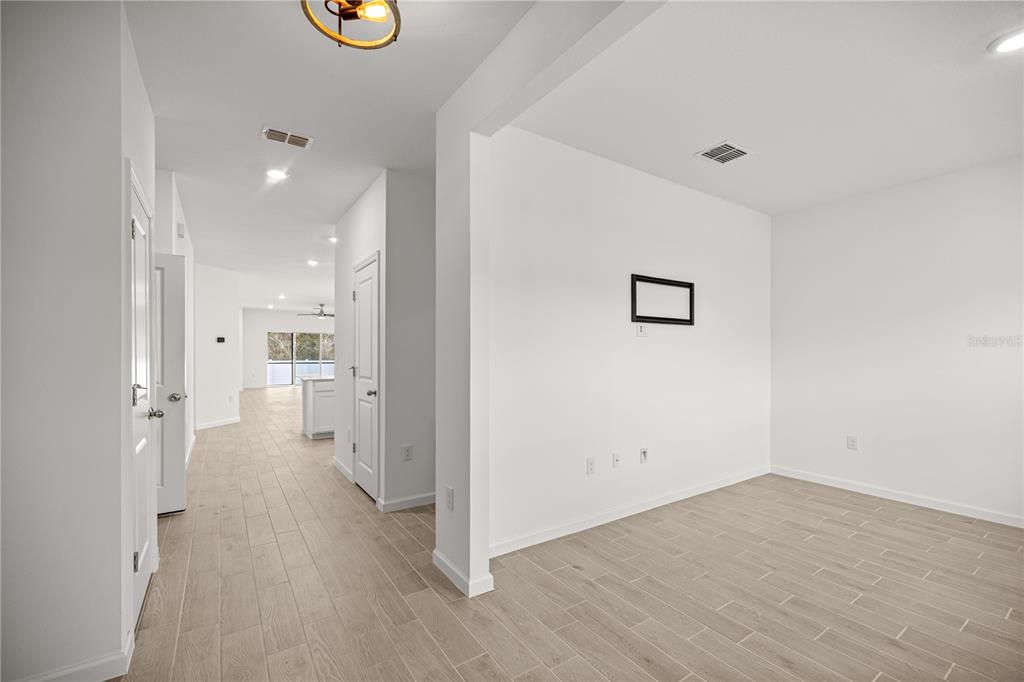 1604 Northwest 44th Court Road Ocala, FL 34482 - Photo 8 of 41 a view of a hallway with wooden floor