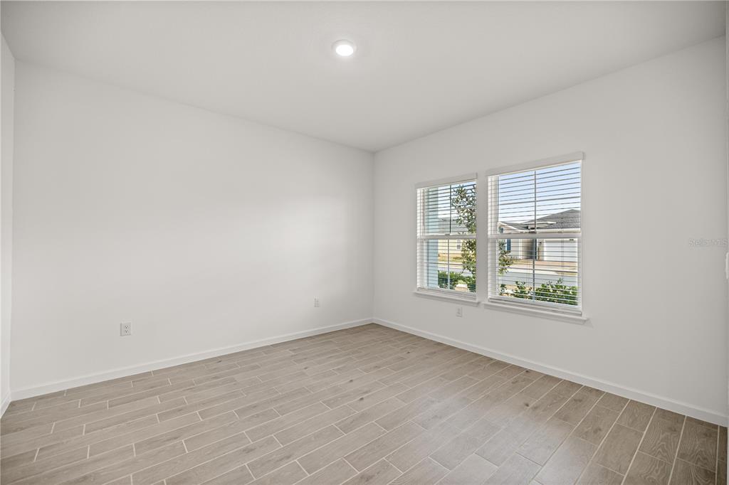 1604 Northwest 44th Court Road Ocala, FL 34482 - Photo 10 of 41 an empty room with windows