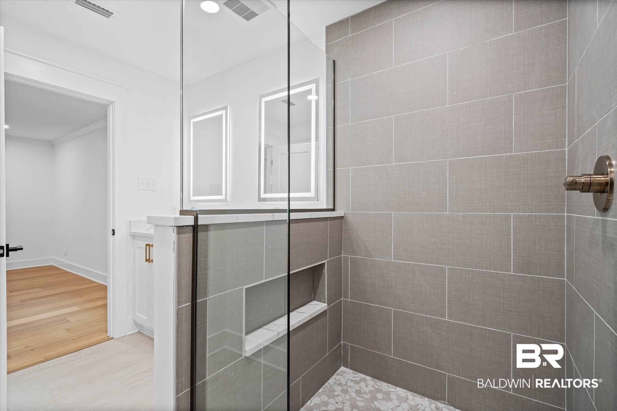 11 Schwaemmle Drive Mobile, AL 36608 - Photo 15 of 32 Full bath with a shower stall, crown molding, and light wood-type flooring