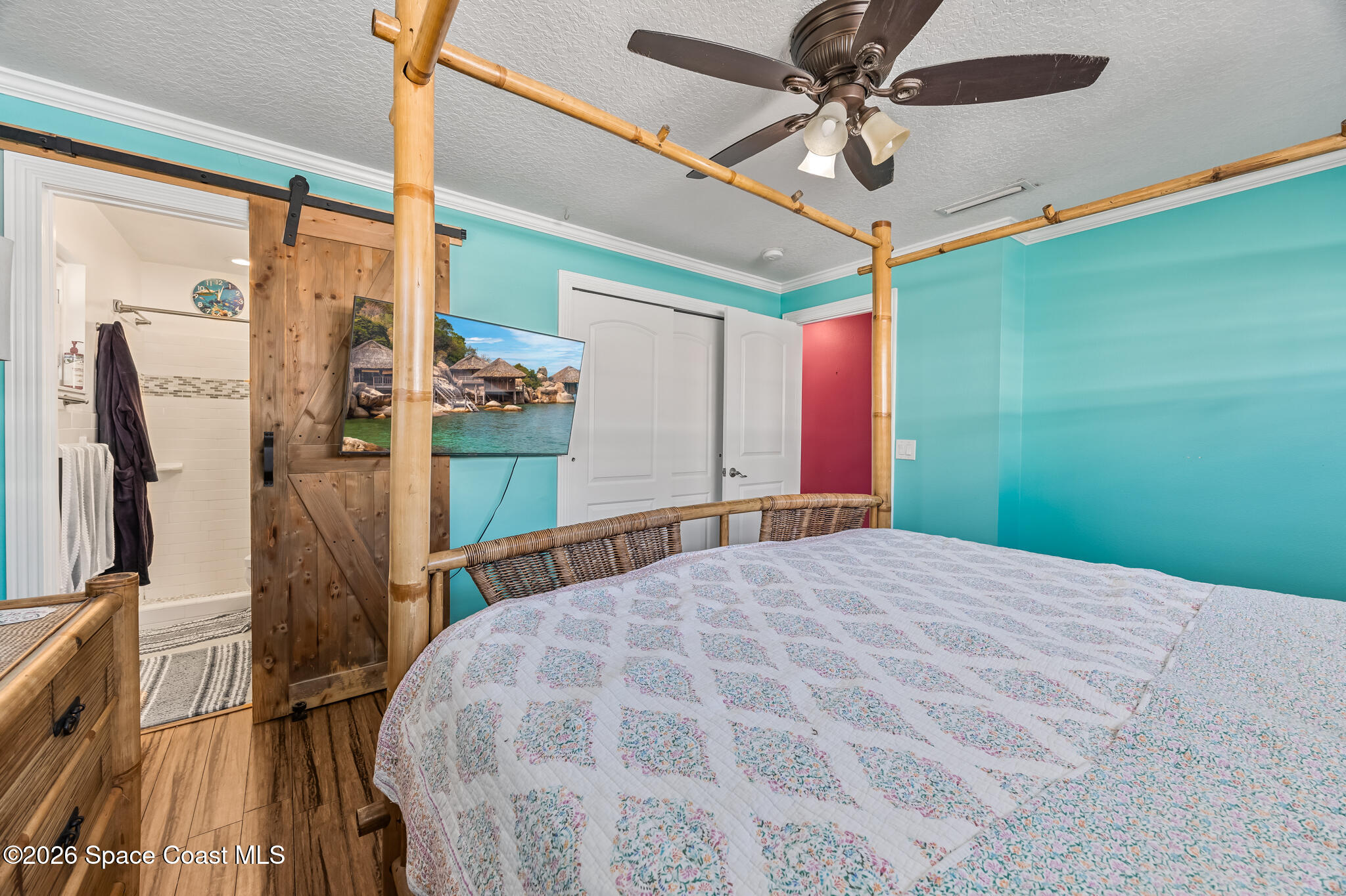 770 New Hampton Way Merritt Island, FL 32953 - Photo 15 of 48 a bed sitting in a bedroom next to a window