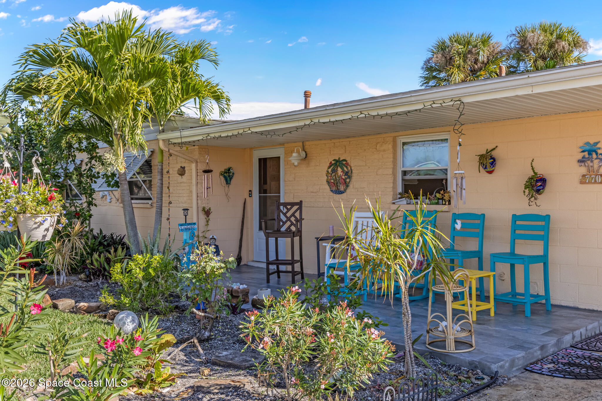 770 New Hampton Way Merritt Island, FL 32953 - Photo 2 of 48 a front view of a house with garden