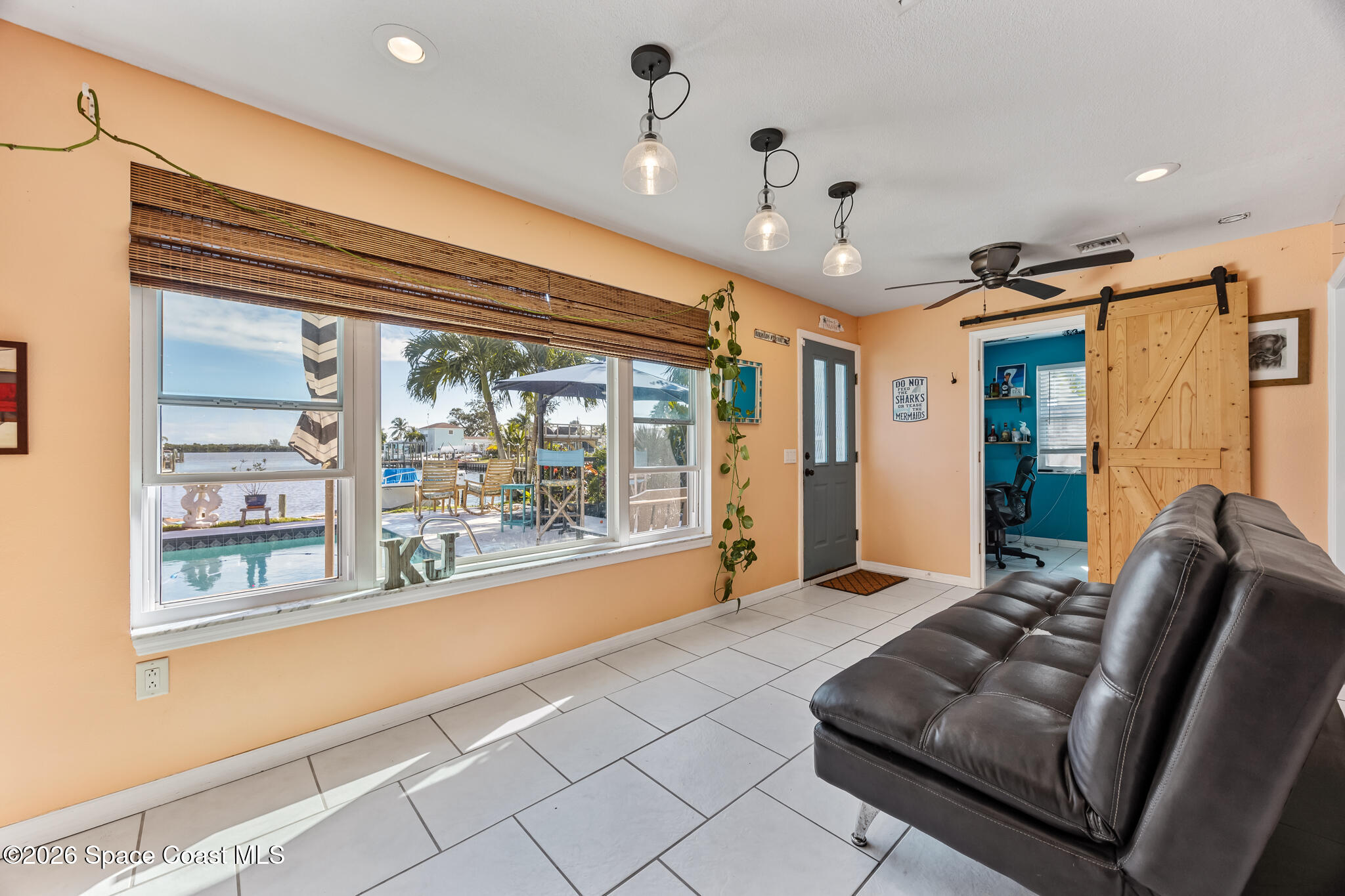 770 New Hampton Way Merritt Island, FL 32953 - Photo 23 of 48 a living room with furniture and a large window